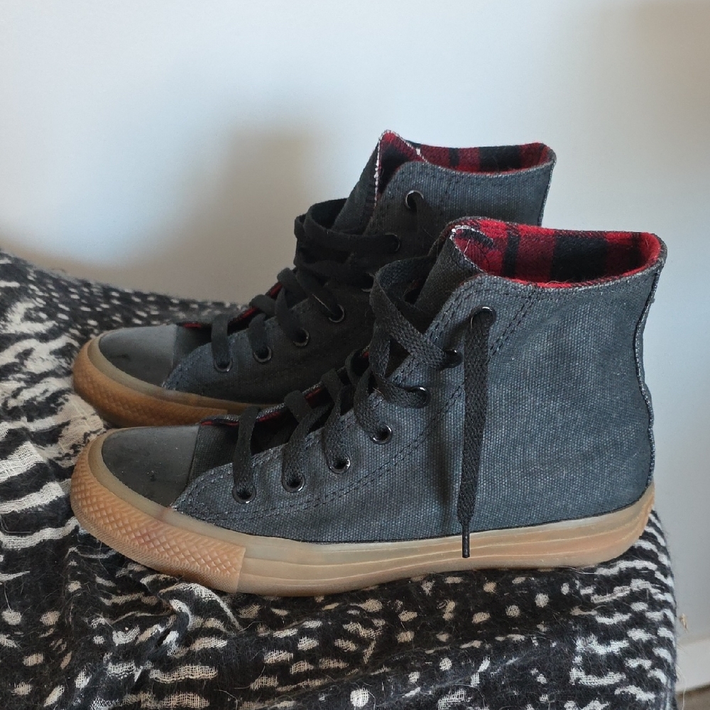 Converse Black High-Top Sneakers with Red Plaid Lining.